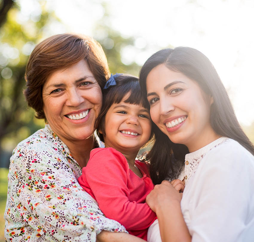 Ozone therapy benefits for dental health, featuring a smiling woman and child with a dental professional, promoting non-invasive treatment and healing.